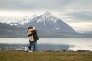 Surprise engagement captured by Interlaken photographer John Wisdom in Switzerland Surprise engagement by Lake Thun near Interlaken