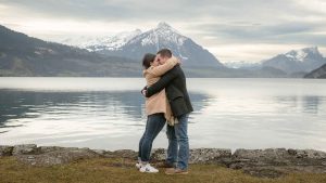 Surprise engagement captured by Interlaken photographer John Wisdom in Switzerland Surprise engagement by Lake Thun near Interlaken