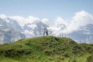Surprise Engagement above Wengen Photographer for a surprise wedding proposal on Männlichen mountain.