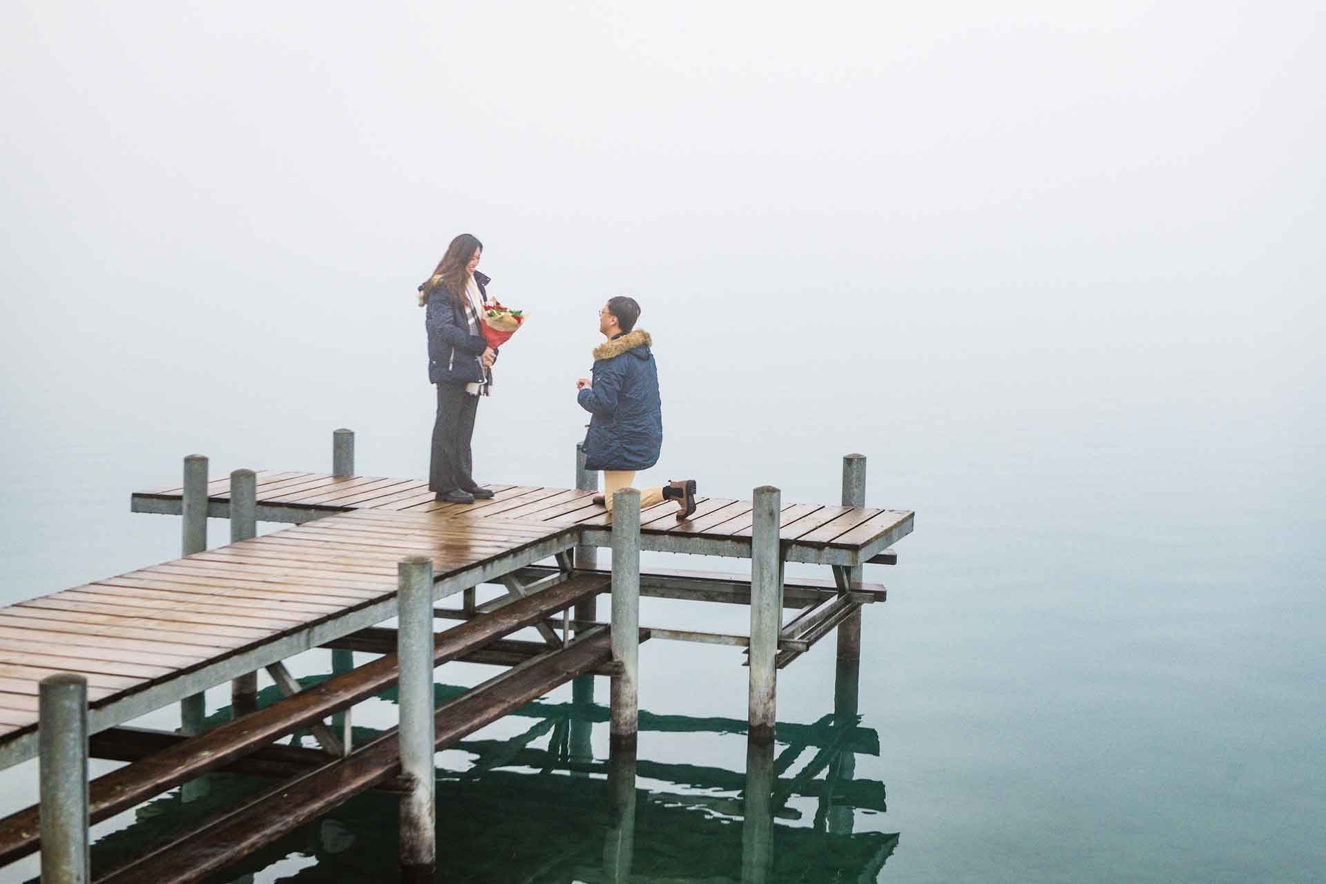 Surprise engagement on the pier in Iseltwald, Switzerland