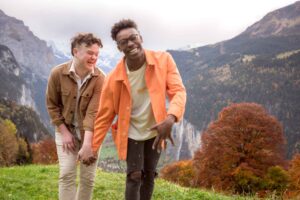 LGBTQ+ Engagement in the Swiss mountains. A same sex surprise proposal near Lauterbrunnen, SWitzerland.