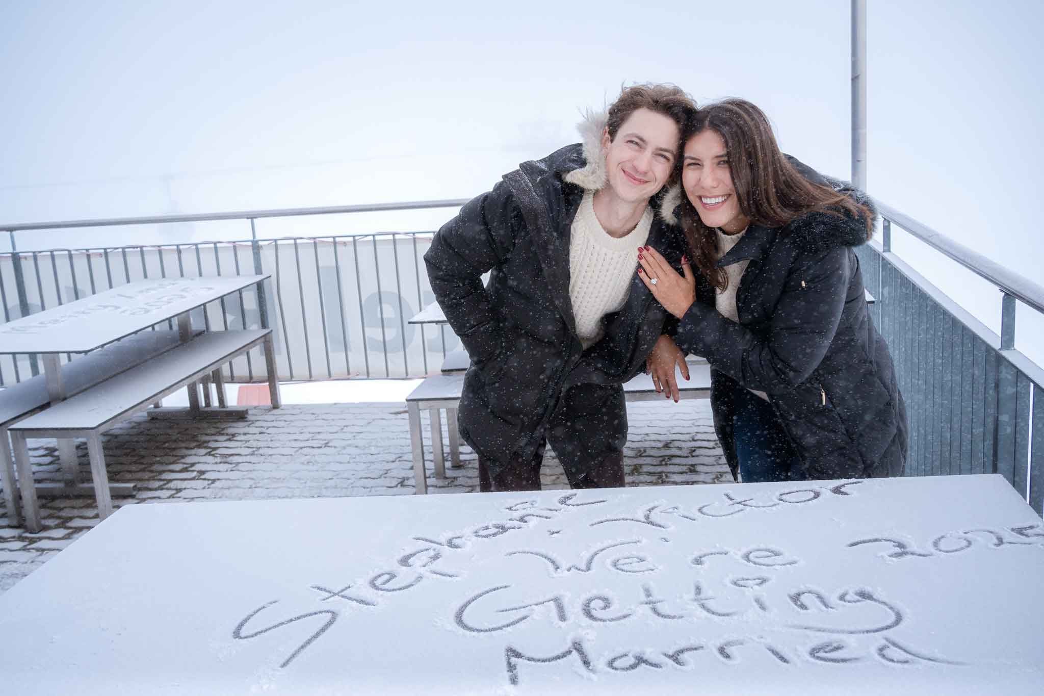 Surprise Engagement in Grindelwald Switzerland on First mountain summit. 