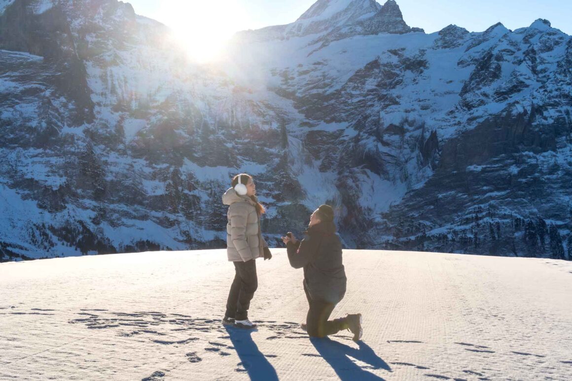 A surprise marriage proposal on Grindelwald First mountain. An engagement proposal with the Eiger mountain as a backdrop.