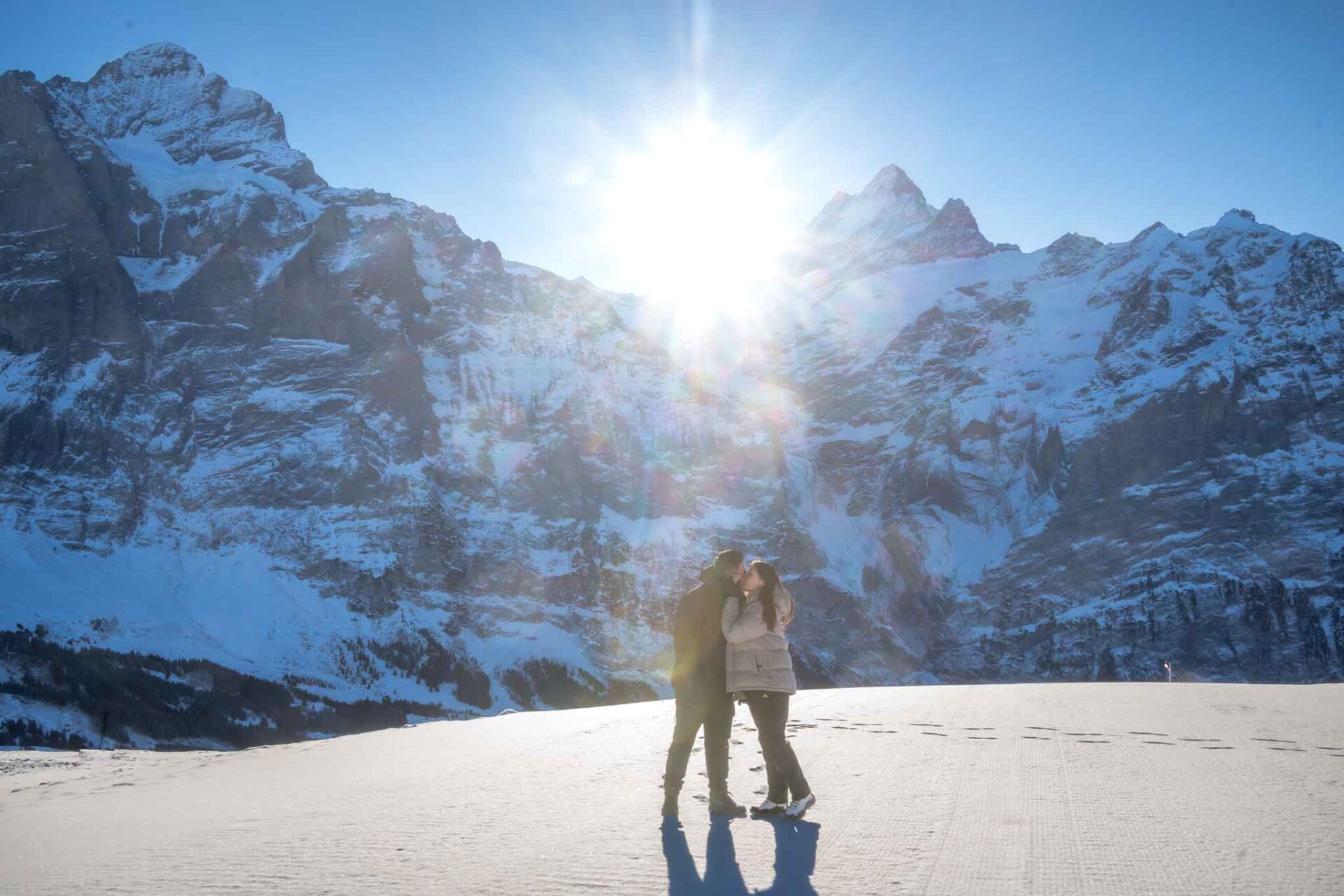 A surprise marriage proposal on Grindelwald First mountain. An engagement proposal with the Eiger mountain as a backdrop.